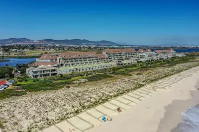 an aerial view of a resort on the beach at Dolphin Beach H305 in Cape Town