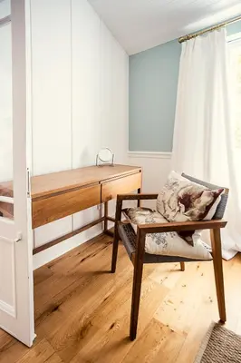 a bedroom with a bunk bed and a chair at Roubaix House - A Heritage Retreat in the Heart of Franschhoek in Franschhoek