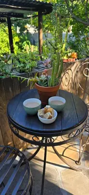 a blue table with bowls of food on it at Petite Vine in Stellenbosch