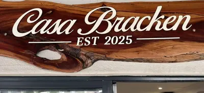 a sign for a car bakery on a wall at Casa Bracken in Windsor Park