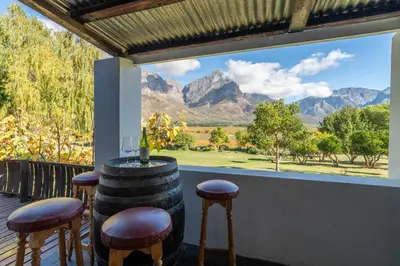 a bar with a view of the mountains through a window at Grietjiesdrif- Mountain Retreat in Rawsonville