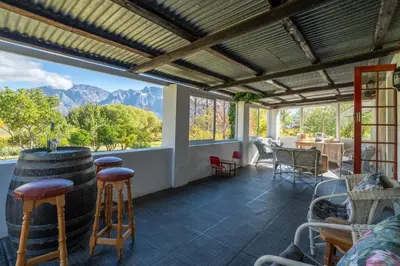 a tasting room with a view of the mountains at Grietjiesdrif- Mountain Retreat in Rawsonville
