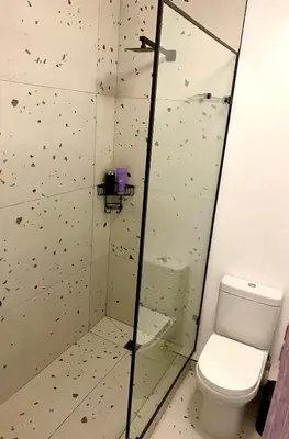 a bathroom with a shower with a toilet at Studio Apartment 100 meters to Strand Beach in Strand