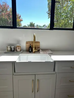 a white kitchen with a sink and a window at Guest Suite in Stellenbosch in Stellenbosch
