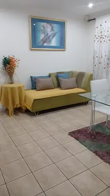 a living room with a couch and a table at Neats Accommodations in Cape Town