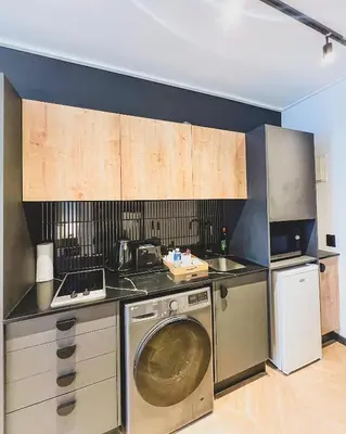 a kitchen with a washer and a dishwasher at Promise on Nine Palms Century in Cape Town