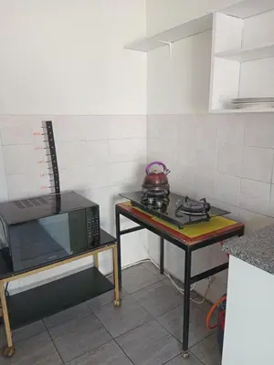 a kitchen with a stove and a tea pot on a table at Lucian Bed and Breakfast in Goodwood