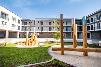 a park with wooden poles in front of a building at Paarl Studio With Onsite Parking & Modern Comforts in Paarl