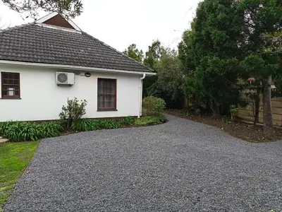 a driveway in front of a white house at Somerset West Stay 2 in Somerset West