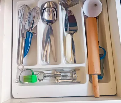 a drawer filled with spoons and utensils at Entire 2 Level Townhouse in Backenfell Cape Town in Brackenfell