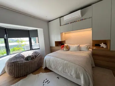 a bedroom with a bed and a large window at Villa Victoria in Paarl