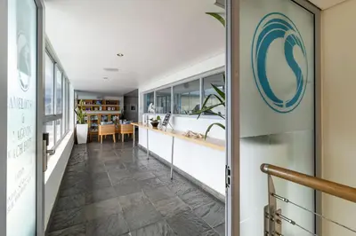 an internal corridor of a house with a door leading to a kitchen at 2 Bedroom Seaview, Holiday Apartment, Lagoon Beach in Cape Town