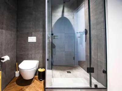 a bathroom with a shower with a toilet in it at On Park Century City in Cape Town