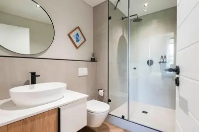 a bathroom with a sink and a shower at Century City Natures Treat in Cape Town
