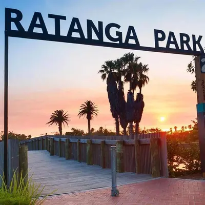 a street sign with palm trees in the background at On Park - Century City Lux Studio Apartment in Cape Town
