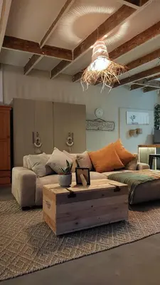 a living room with a couch and a coffee table at Beach Pebble - 200m walk to beach kite surfer paradise, work friendly, pet friendly - must request in Bloubergstrand