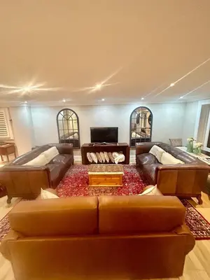 a living room with two couches and a couch at French Manor 1 in Stellenbosch