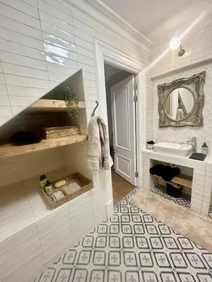 a bathroom with a sink and a mirror at French Manor 1 in Stellenbosch