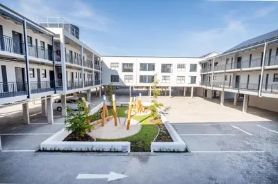 an empty parking lot in an apartment complex at Paarl 137 - Superior Studio Apartment with AC and Parking in Paarl