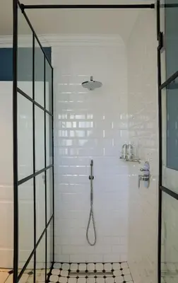 a shower with a glass door in a bathroom at Seabreeze Retreat in Hermanus