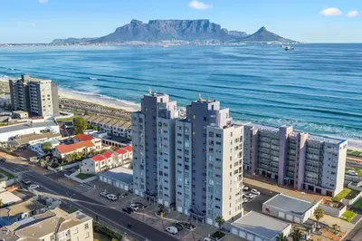 an aerial view of a city and the ocean at Ocean View B503 in Cape Town