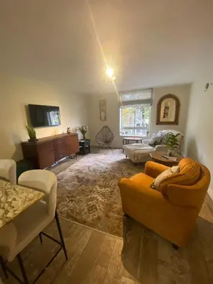 a living room with two couches and a tv at Amatoni 44 in Stellenbosch