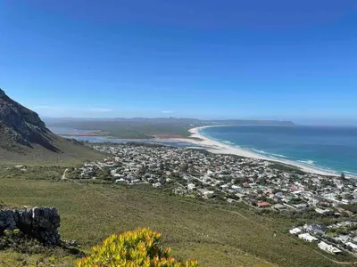 an aerial view of a city and the ocean at Voelklip Holiday Home in Hermanus