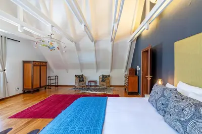 a bedroom with a large bed in a room at The Manor at Mont Angelis Estate in Stellenbosch