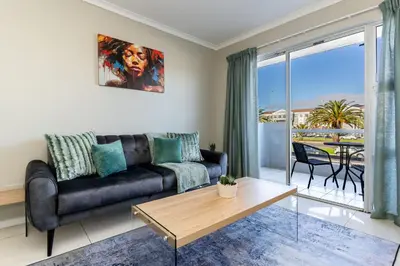 a living room with a couch and a table at South Views 14 in Cape Town
