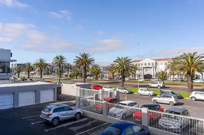 a parking lot with cars parked in a parking lot at South Views 14 in Cape Town