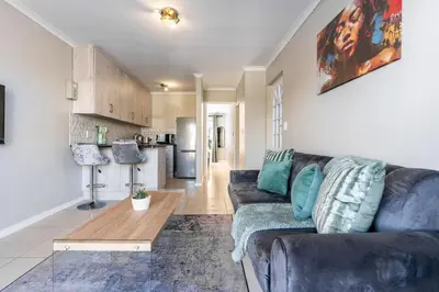 a living room with a couch and a table at South Views 14 in Cape Town