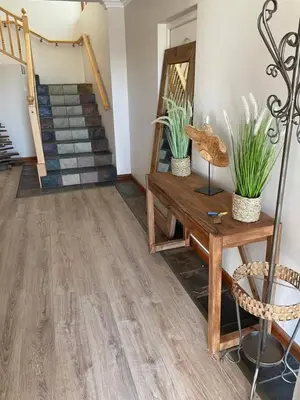 a room with a wooden floor and stairs at Sea 'n Summit Hermanus in Hermanus