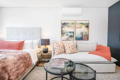 a living room with a couch and a glass table at 136 Paarl Studio With Onsite Parking Comforts in Paarl