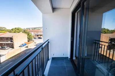 a balcony with a view of a street at Paarl 225 - Lux Modern 2 Bedroom Apartment with Parking in Paarl