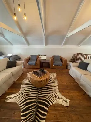 a living room with a large star rug on the floor at Stay At Nantes in Paarl
