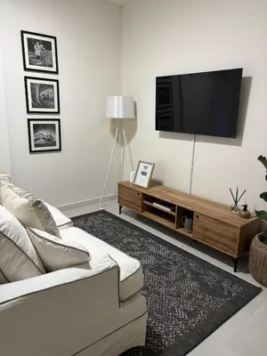 a living room with a couch and a flat screen tv at Inside Out Bliss in Paarl