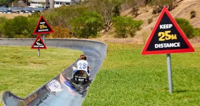 a person riding a skateboard down a ramp with signs at Cosy Flatlet in Chrismar in Stikland