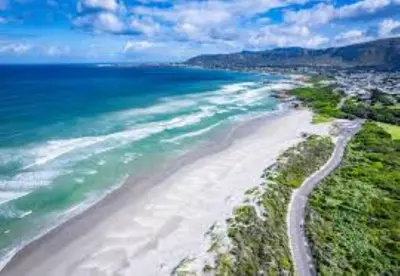 an aerial view of a beach and the ocean at Breakwater Nr 4 holiday apartment in Hermanus
