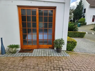 a wooden door on the side of a house at Protea Rus in Wellington