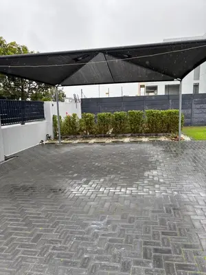 a patio with a black canopy in a building at Studio Apartment in Cape Town in Cape Town
