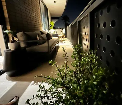 a balcony with a couch and a plant on a building at ON PARK 317 LUXURY APARTMENT CENTURY CiTY in Century City