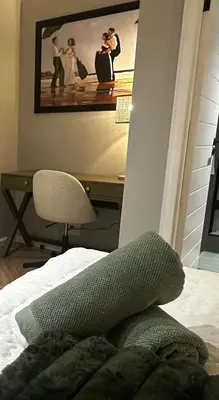 a bedroom with a bed and a desk with a picture at ON PARK 317 LUXURY APARTMENT CENTURY CiTY in Century City