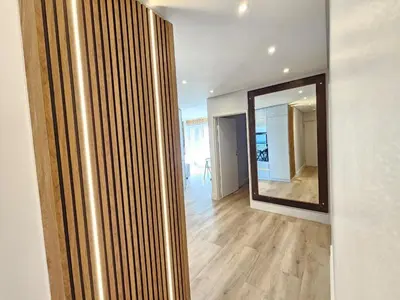a hallway with a large mirror in a house at Luxury Portico Apartment in Cape Town