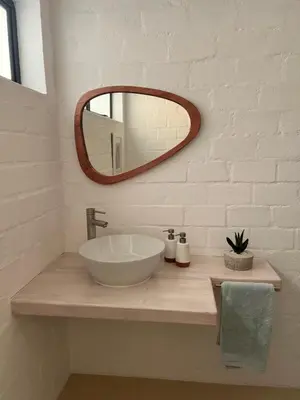 a bathroom with a white sink and a mirror at Lagoon & beach paradise in Lake Marina