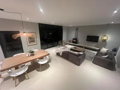 a living room with a table and a couch at Lagoon & beach paradise in Lake Marina