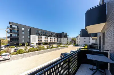 a balcony with a view of a parking lot at Nine Palms - Century City Luxury Apartment in Cape Town