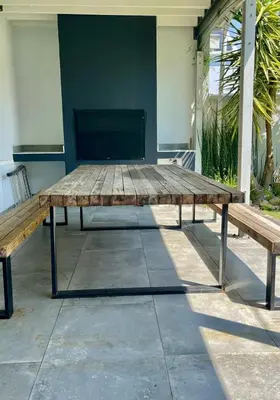 a wooden picnic table with two benches on a patio at Franschhoek Gem on Van Wijk in Franschhoek