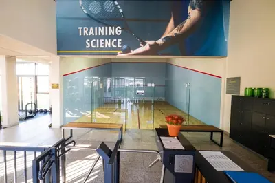 a room with a tennis science sign on the wall at #AlimamaSpaces Manson's Fynbos Villa in Cape Town