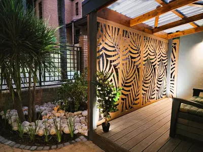 a patio with a wooden deck with plants and a fence at Overflowing Life - Accommodation near Paarl Gim in Paarl