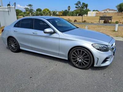 a silver car parked in a parking lot at Mercedes Benz C180 in Cape Town